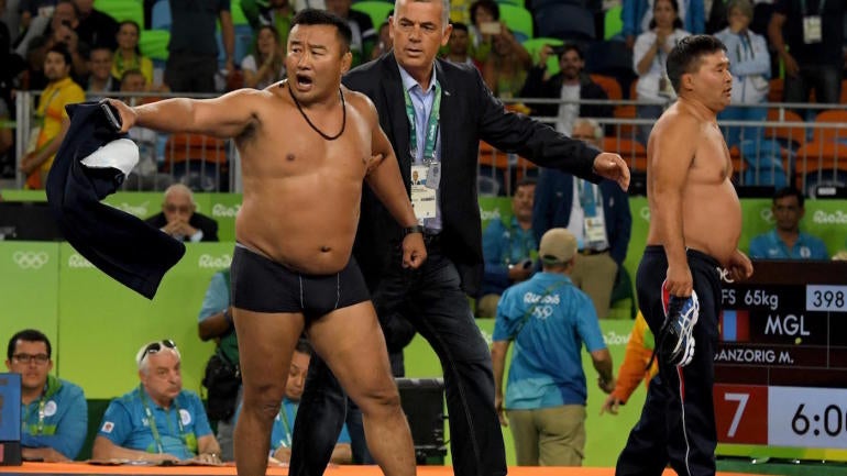 Mongolian coaches who stripped to underwear in protest receive punishment
