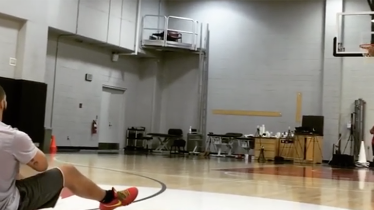 WATCH: Drake channels Steph Curry, makes half-court shot while sitting down