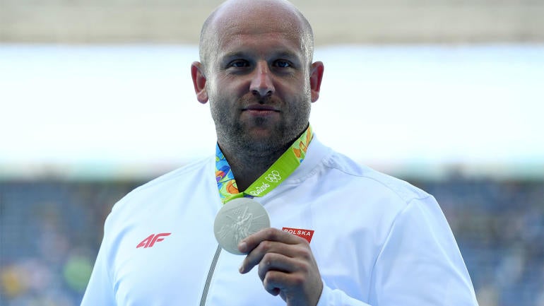 Olympian sells silver medal to help pay for child's cancer treatment