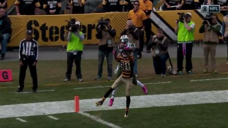 WATCH: Fitzpatrick tries to throw awful INT, but Brandon Marshall steals it for a TD