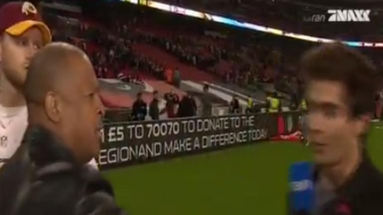 Redskins PR guy pushes reporter to stop kicker's TV interview in London