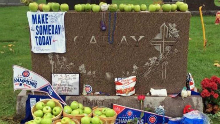 LOOK: Cubs fans leave green apples at Harry Caray's grave after World Series win