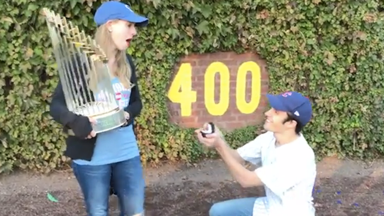 WATCH: Cubs fan proposes to girlfriend while she's holding World Series trophy