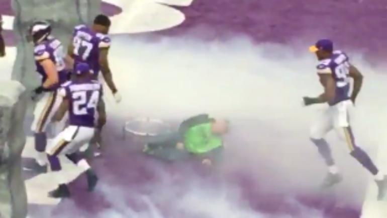 WATCH: Vikings trample a man carrying microphone as they run out onto the field