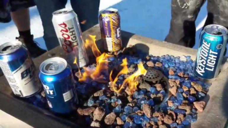 Vikings fans tailgate in 20 below zero weather, use fire to keep beer from freezing