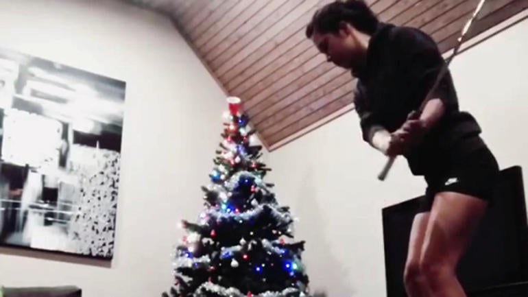 WATCH: Holiday golf trick shots involve Christmas tree, trampoline