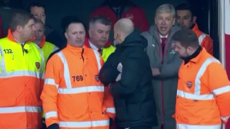WATCH: Furious Arsenal manager Arsene Wenger pushes official three times