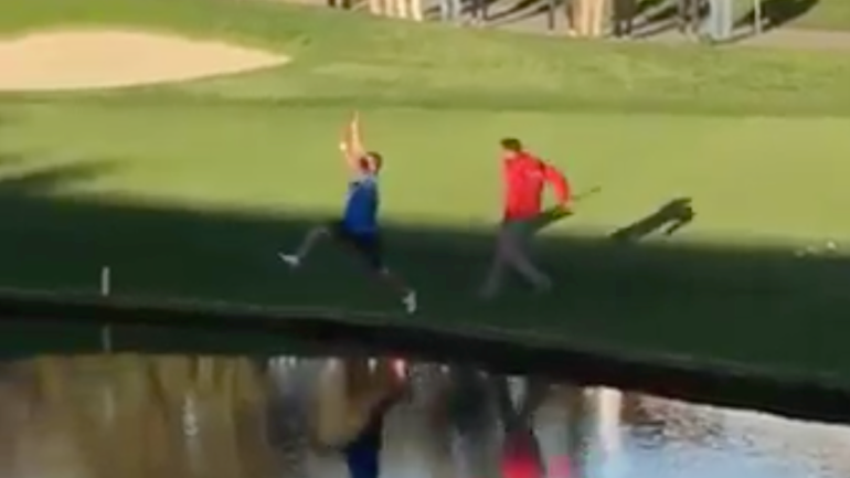 WATCH: Golf fan dodges security by jumping into lake on the course