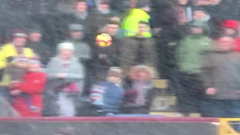 Burnley fan has some serious dad reflexes, saves shot from smacking child in the face