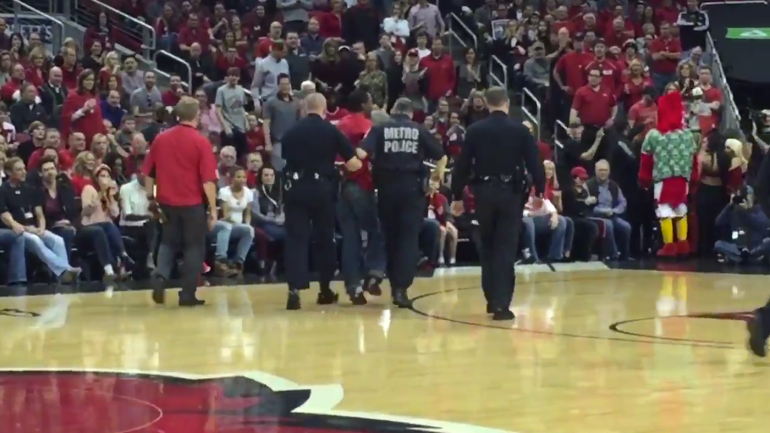 Louisville fan who ran on court reportedly kicked dancer, 'threatened to kill everyone'