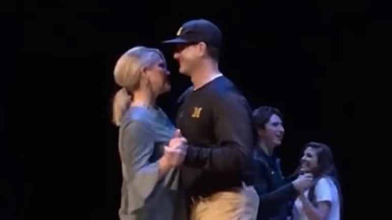 WATCH: Jim Harbaugh slow dances with his wife in full sideline attire at fundraiser