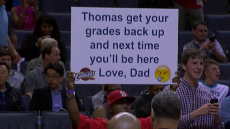 LOOK: Dad trolls his son for bad grades with hilarious signs at NBA games