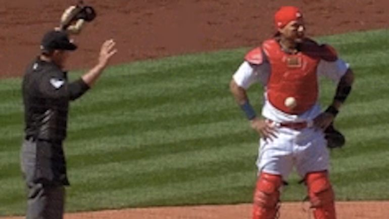 WATCH: Somehow, this pitch got stuck to Yadier Molina's chest protector like velcro
