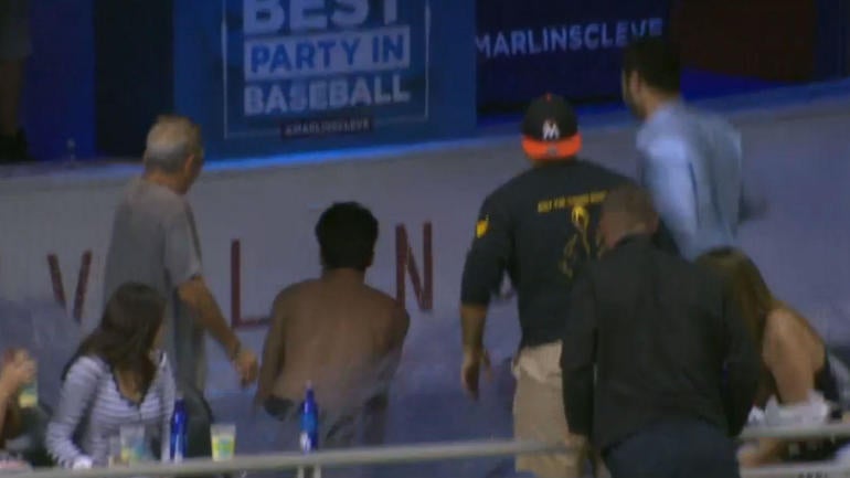 WATCH: Fan jumps into Marlins Park pool to retrieve a home run, but he's too late