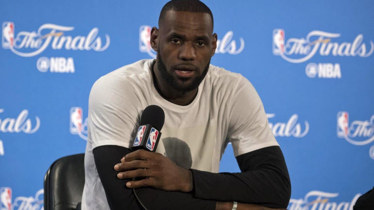 Teacher places supportive signs near LeBron's Ohio home in response to racial slur