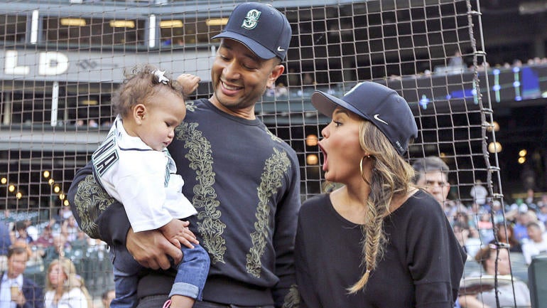 LOOK: John Legend and Chrissy Teigen's daughter throws out first pitch for Mariners