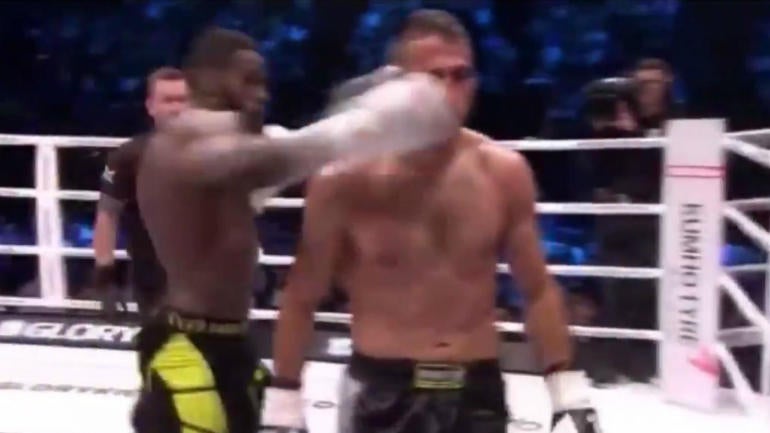 Kickboxer gets knocked out cold while not paying attention, foe assaulted by fans