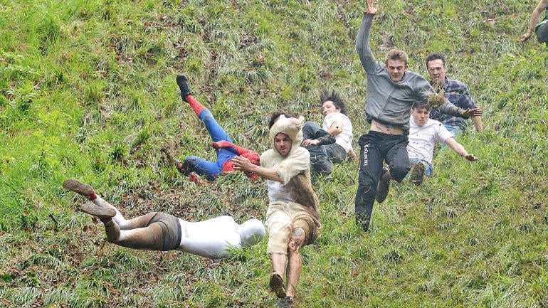 Cooper’s Hill Cheese-Rolling and Wake: Some dude tore his calf to set a new cheese-chasing record