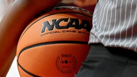 College basketball players among 26 charged by FBI in connection with point shaving, fixing outcome of games