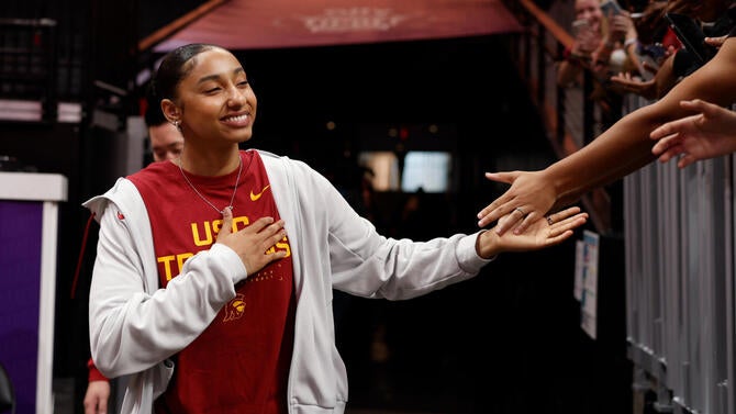 JuJu Watkins high five fan