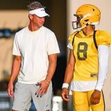 LSU Tigers head football coach Lane Kiffin talking with Quarterback Husan Longstreet 8 at LSU Football practice. August 18,