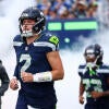 Seahawks QB wearing a No. 2 jersey runs onto the field during the season opener against the New England Patriots.