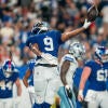 New York Giants tight end Isaiah Likely (9) throws the football in the air after scoring a touchdown during a week one opening