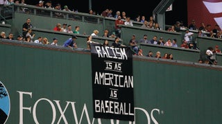 Here's the story behind the anti-prison banner draped over the Green Monster