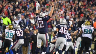 New England Patriots tight end Rob Gronkowski, rear, is hit by Jacksonville  Jaguars safety Barry Church as he breaks up a pass during the first half of  the AFC championship NFL football