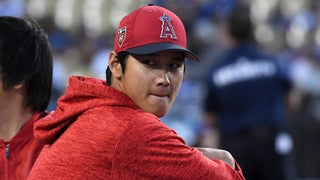 Los Angeles Angels designated hitter Shohei Ohtani arrives in the dugout  before the start of a baseball game against the New York Mets, Saturday,  Aug. 26, 2023, in New York. (AP Photo/Bebeto