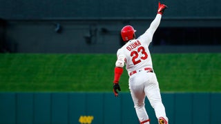 Marcell Ozuna climbs wall