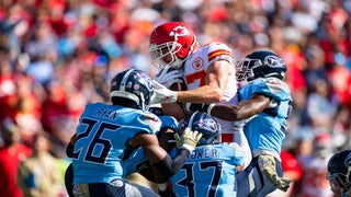 Kansas City Chiefs offensive coordinator Eric Bieniemy talks to Chiefs  tight end Travis Kelce (87) after their win over the Buffalo Bills in an  NFL divisional playoff football game, Sunday, Jan. 23