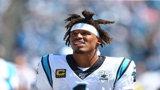 Luke Kuechly of the Carolina Panthers, Greg Olsen, Cam Newton, and