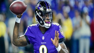 Baltimore Ravens quarterback Lamar Jackson (8) runs out of the tunnel and  waves a towel during player introductions before a NFL football game  against the Miami Dolphins, Sunday, Sept. 18, 2022, in