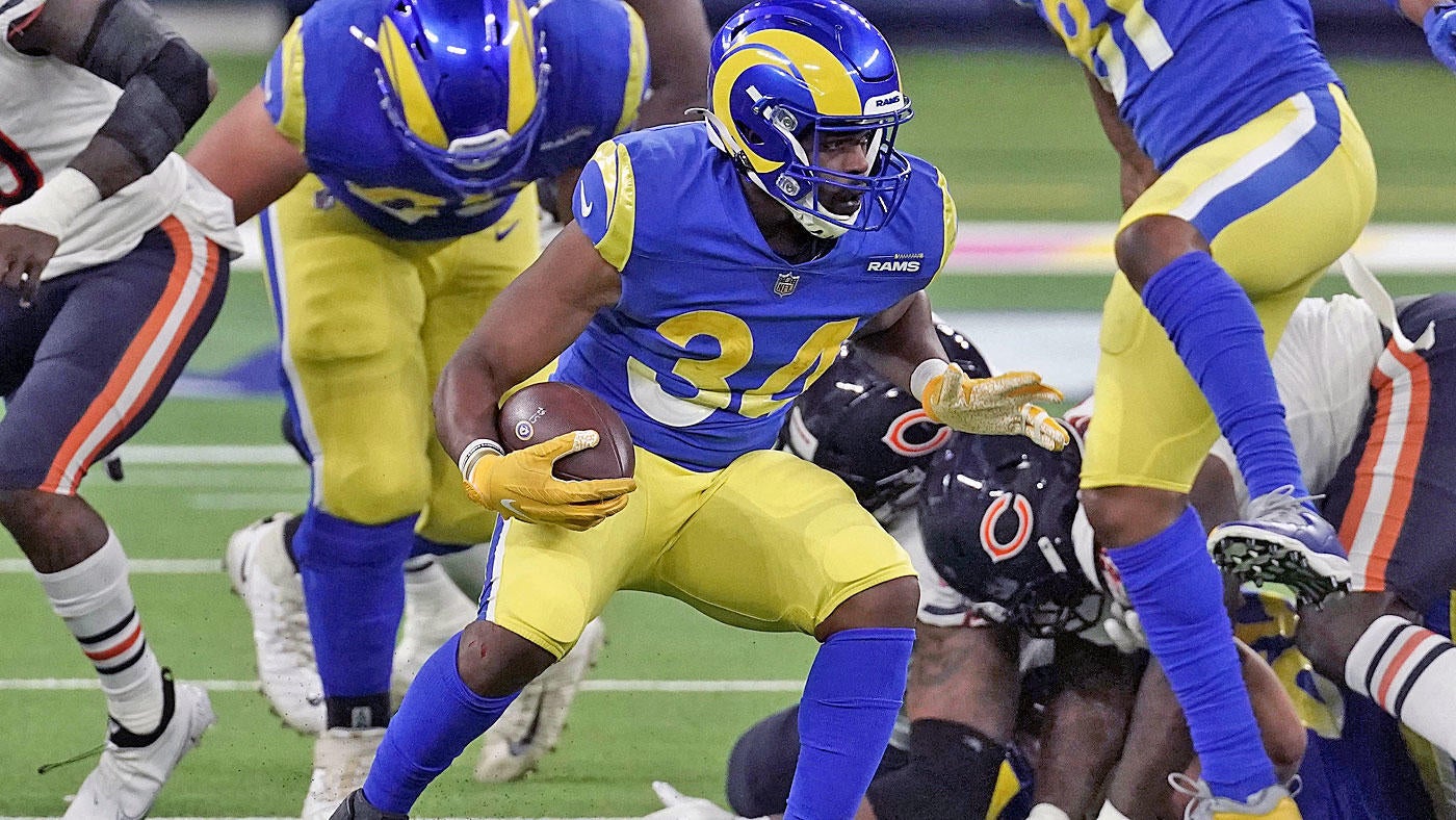 Troy Hill of the Los Angeles Rams tackles Darnell Mooney of the