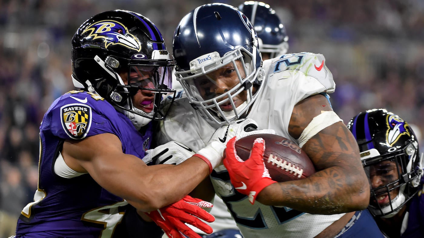 Tennessee Titans Harold Landry III tackles Baltimore Ravens quarterback  Lamar Jackson during overtime of an NFL