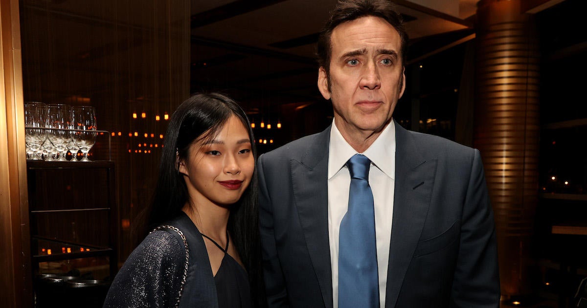 Nicolas Cage and his new wife Riko Shibata pose together for the first magazine cover