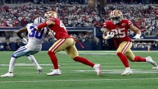 Quarterback Troy Aikman of the Dallas Cowboys rolls out against the News  Photo - Getty Images