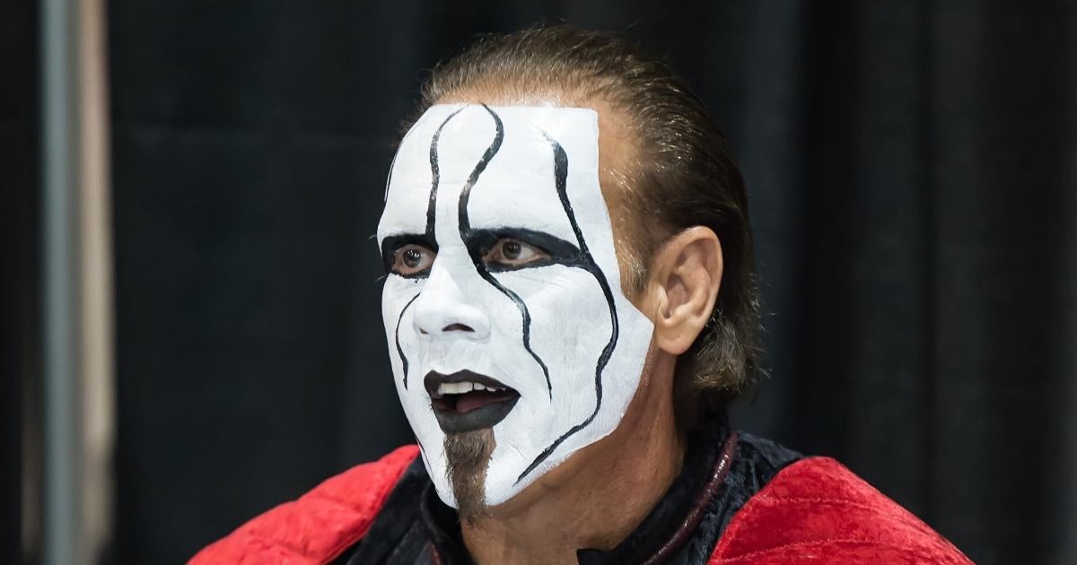 AEW's Sting Jumps off Stage, Crashes Into Table at 62 Years Old.jpg