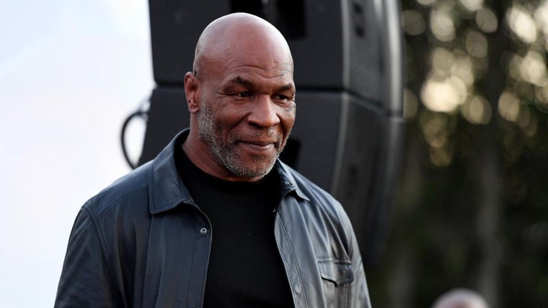 Mike Tyson Repeatedly Punches Man in the Face on Plane