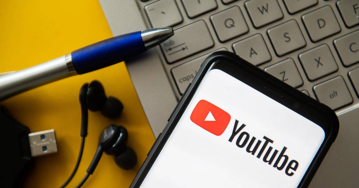In this photo illustration a YouTube logo seen displayed on