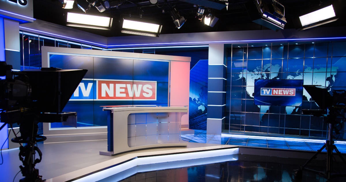 news-anchor-broadcast-studio-camera