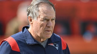 Patriots rookie Brenden Schooler tries to give football to Bill Belichick