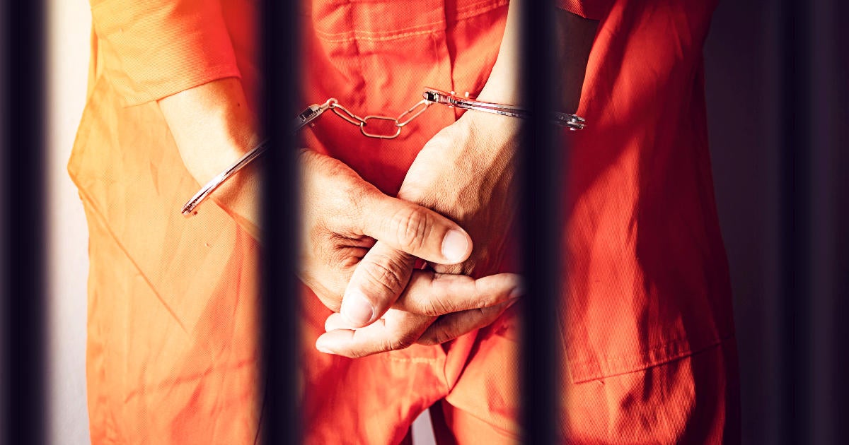 prisoner-with-handcuffs-in-prison