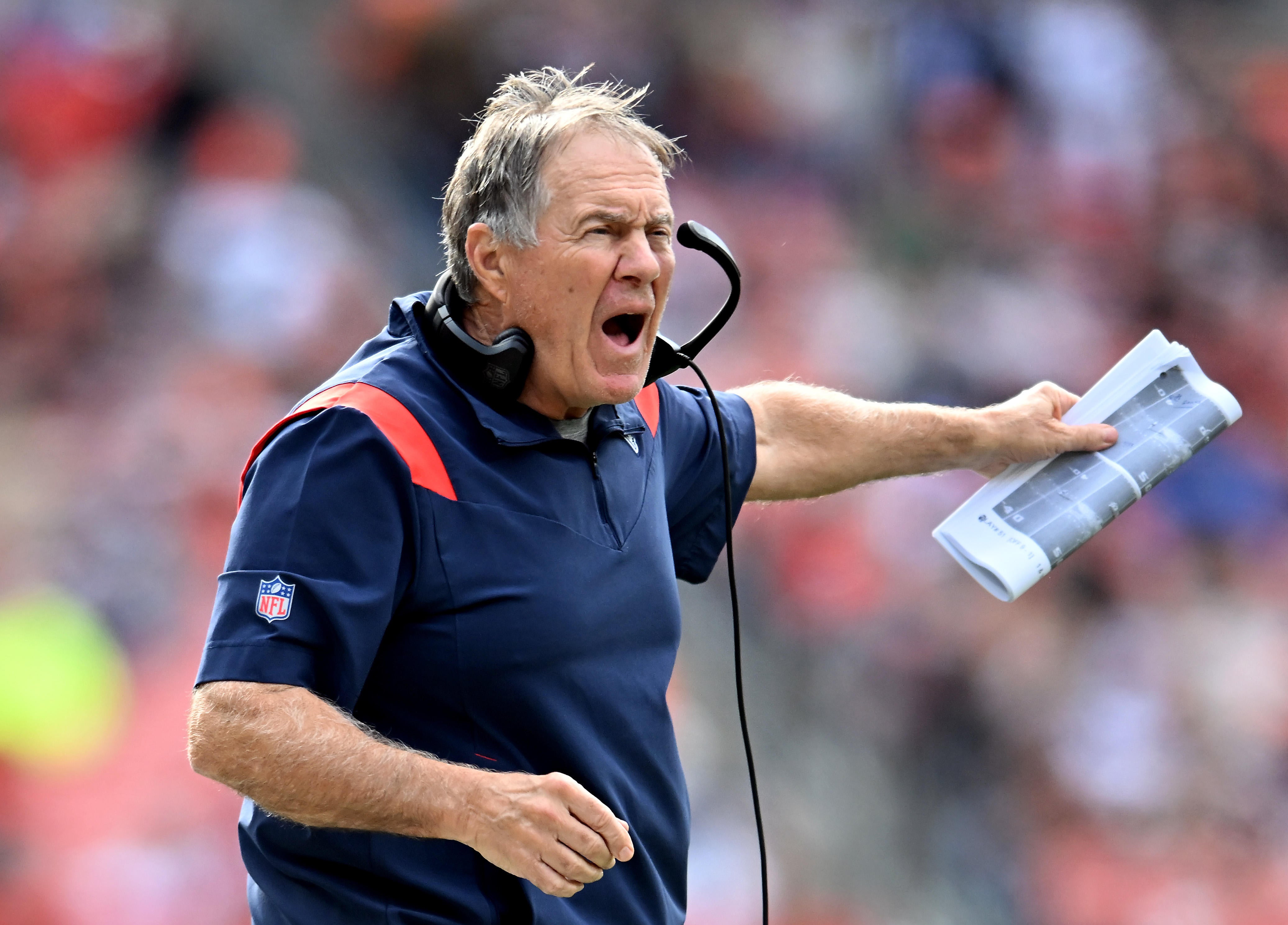 Patriots rookie Brenden Schooler hands ball to a confused Bill Belichick after recovering fumble