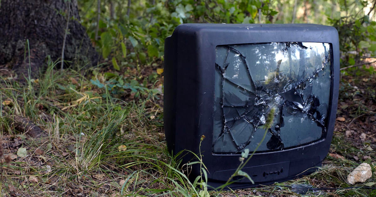 Old, Broken Television Set Abandoned Outside, In Nature
