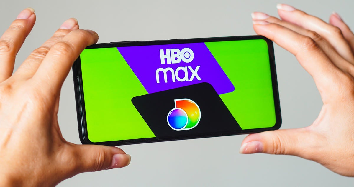 In this photo illustration, the HBO Max and Discovery Plus