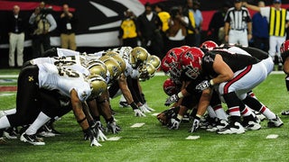 The Atlanta Falcons run out onto the field during pregame events