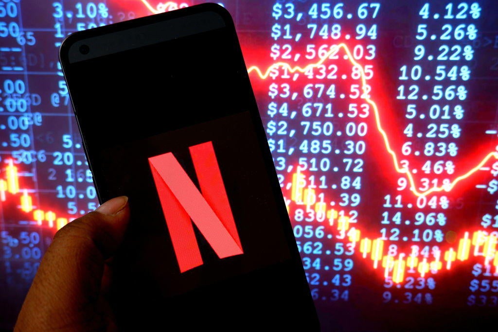 In this photo illustration, a Netflix logo is seen displayed