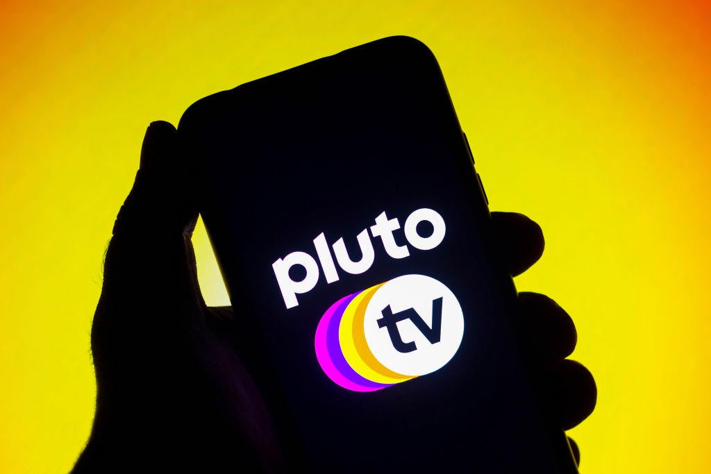 In this photo illustration the Pluto TV logo seen displayed